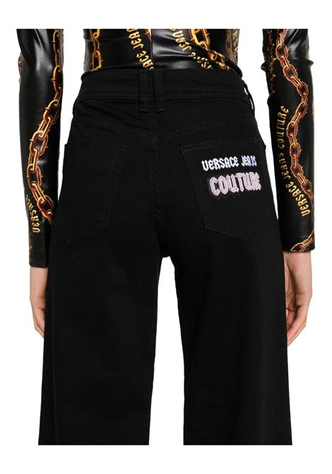 Flared jeans with decorations VERSACE JEANS COUTURE | Trousers | 77HAB506 CDW00909